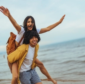 Joyful teens having fun at the beach