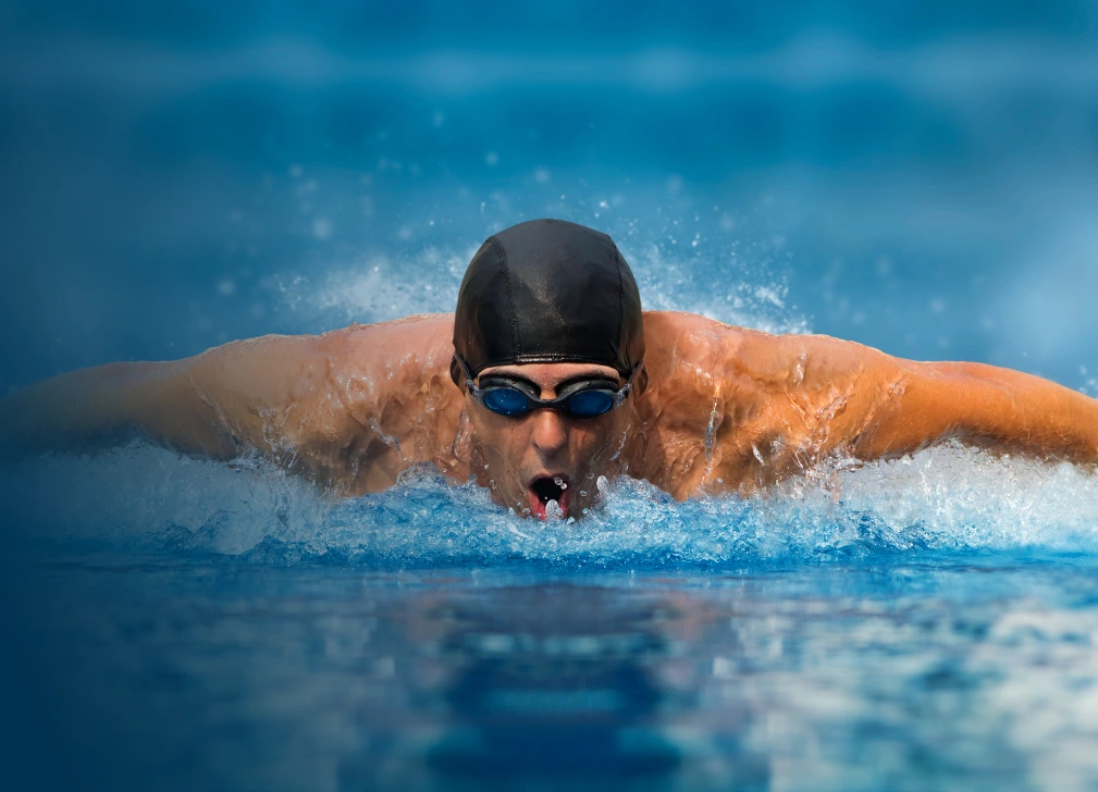 Athletic swimmer wearing goggles