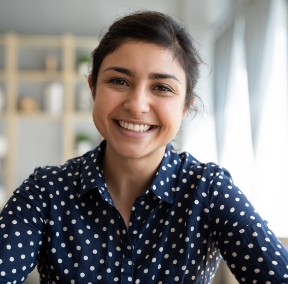 smiling woman at home post-LASIK surgery