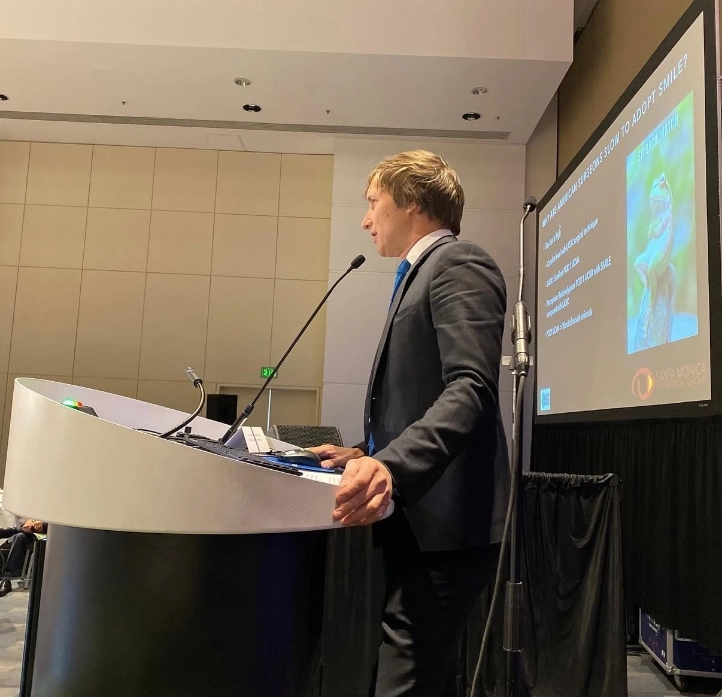 Dr. Rex Hamilton speaking at event