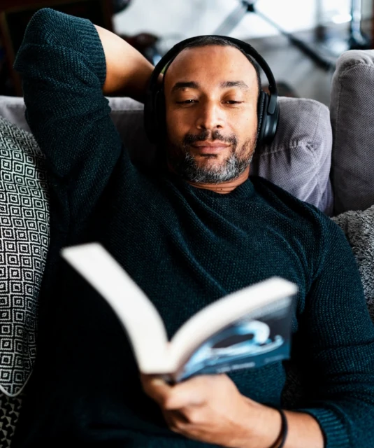 man in 40's reading book without glasses