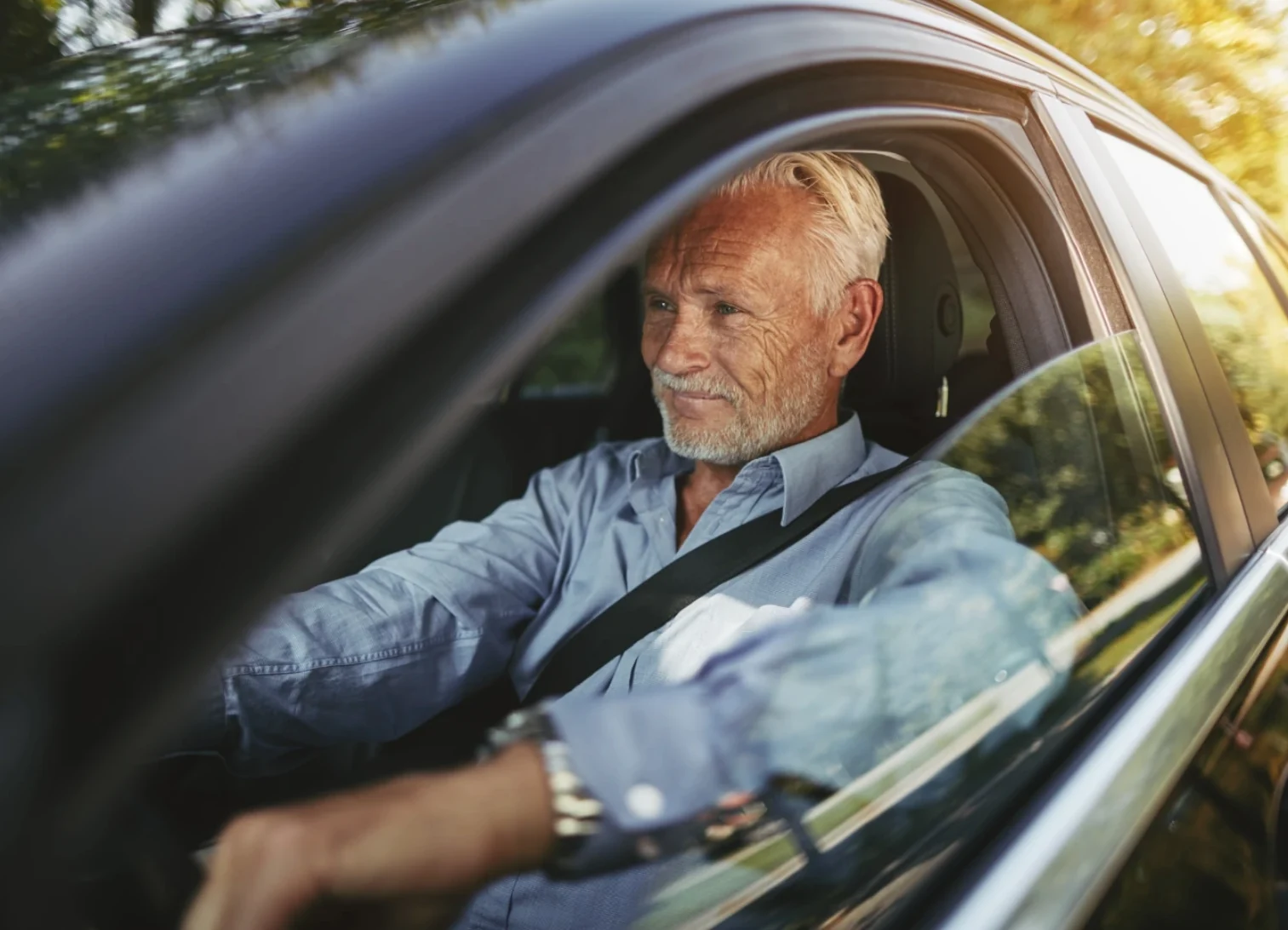 Confident senior man driving with clear vision