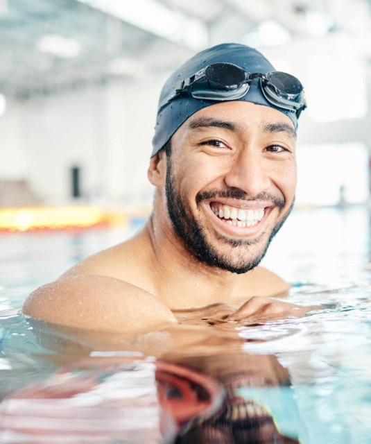 young male athlete swimmer in swimming pool